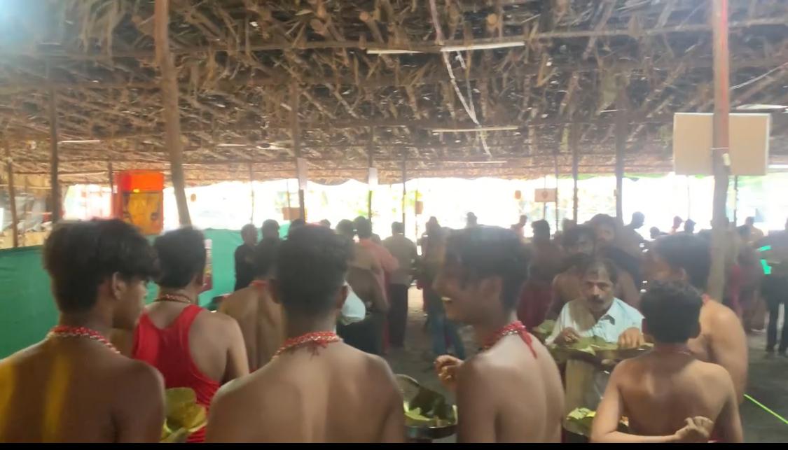 Devotees Receiving Sacred Food